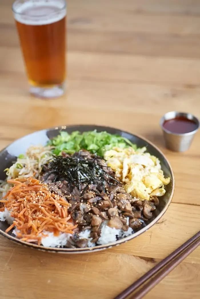 Bibimbap rice bowl with beef, vegetables, and egg